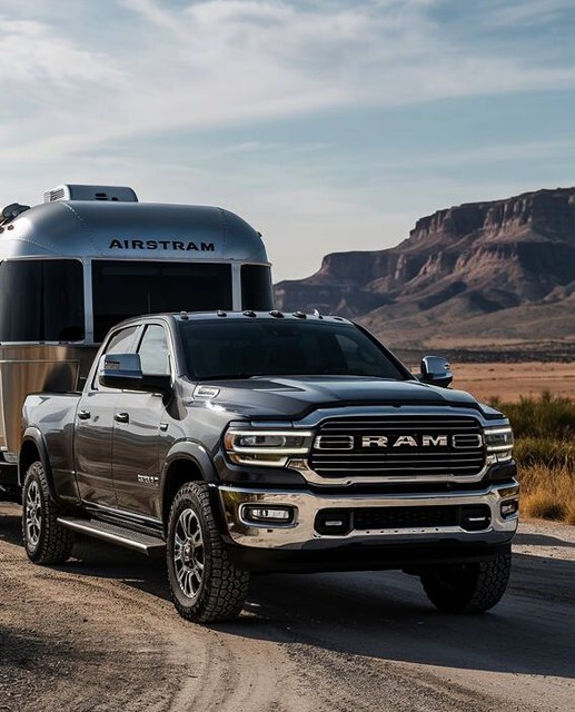 Black RAM Truck hauling Camper-RAM certified collision repair